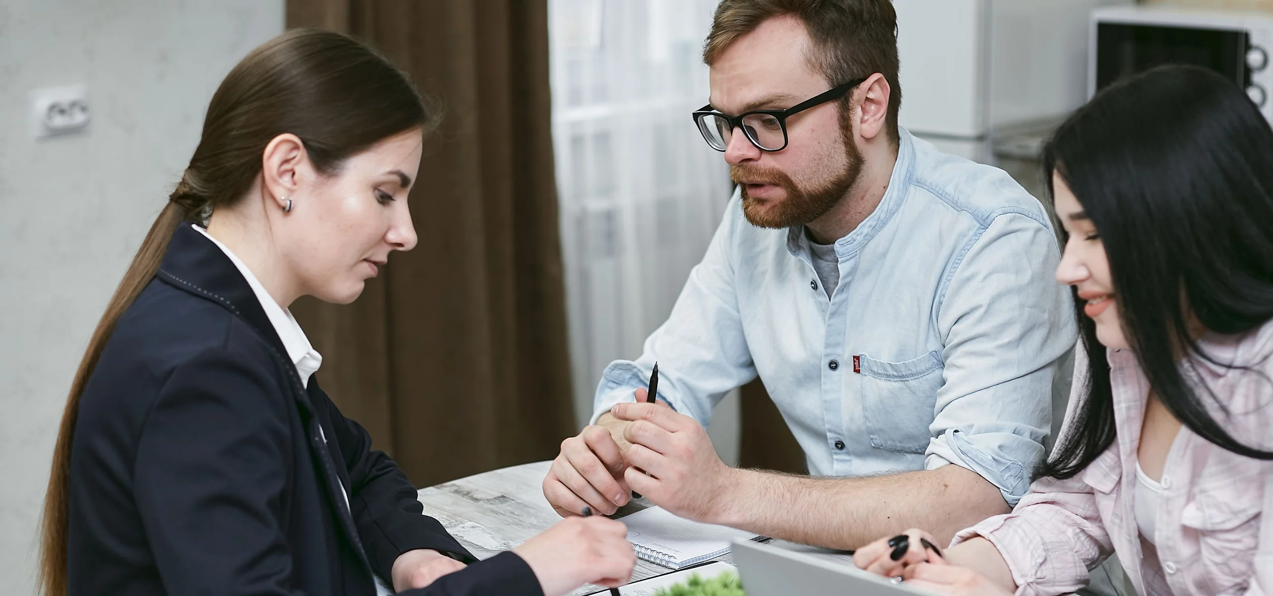An agent going through carrier options with a couple